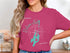 Compass rose and map of Balsam Lake, Ontario on a pink t-shirt.