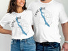 White t-shirts featuring "Long Lake Maine" text and compass graphic with lake silhouette.