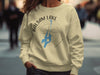 Cream sweatshirt with Balsam Lake Ontario map and compass graphic.