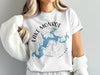 White t-shirt with Lake Monroe Indiana map design and compass graphic.