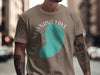Brown t-shirt with a turquoise outline of Newnans Lake, Florida.