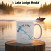 Maligne Lake Canada mug with compass graphic on a lake at sunrise.