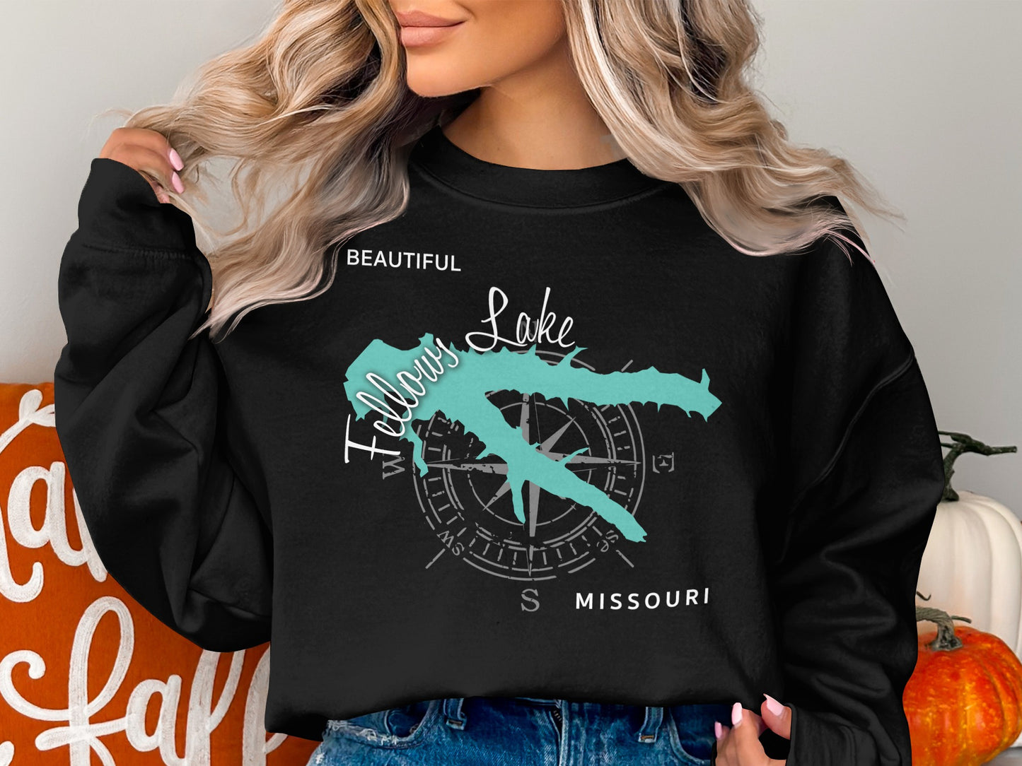 Black sweatshirt with turquoise Fellows Lake map and compass graphic.