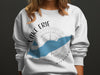 White sweatshirt with Lake Erie outline, compass graphic, and "Lake Erie Michigan" text.