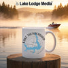 White mug with Lake Thunderbird map and compass design on a lakeside background.