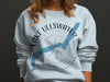 Light blue sweatshirt with a compass and Lake Ullswater map graphic and text.