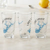 Three clear glasses with blue Lake Lanier maps and compass designs.