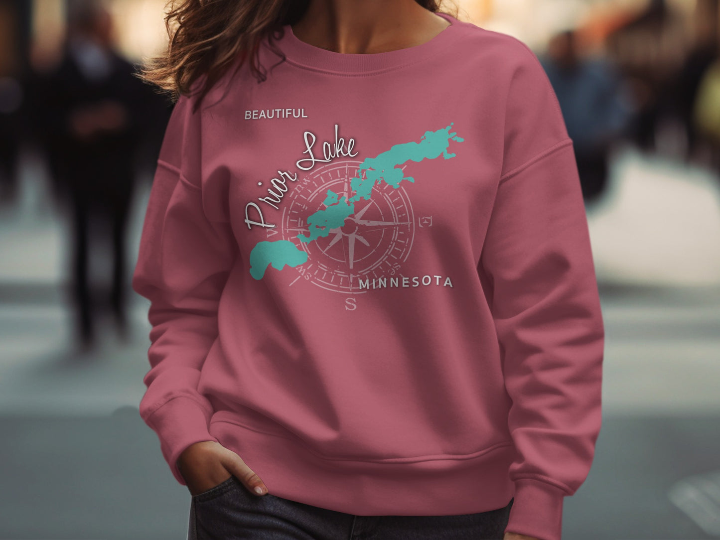 Pink sweatshirt with "Beautiful Prior Lake Minnesota" and compass graphic.
