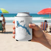White koozie with Bass Lake map design and compass on a beach.
