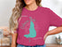 Teal Calcasieu Lake, Louisiana map graphic on a pink t-shirt.