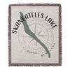 Woven throw blanket with Skaneateles Lake outline, compass rose, and text.