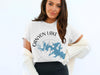 White t-shirt with "Canyon Lake Texas" text and a blue lake outline graphic.