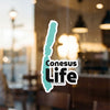 Conesus Life sticker with turquoise lake shape and copyright text.