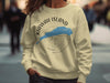 Yellow sweatshirt with "Kiawah Island South Carolina" text and compass graphic.