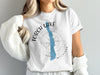 White t-shirt with "Torch Lake Michigan" text, map, and compass graphic.