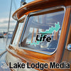 Teal Wallenpaupack Life sticker on boat window with "Lake Lodge Media" logo.