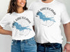 White t-shirts featuring the text "LAKE KABETOGAMA MINNESOTA" and a lake outline graphic.
