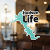 Turquoise map outlines the words Hudson Life, with copyright text below.