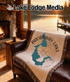 Woven throw blanket featuring Broadway Lake map and compass design.