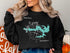 Black sweatshirt with "Beautiful Lake Spivey" map graphic and compass rose.