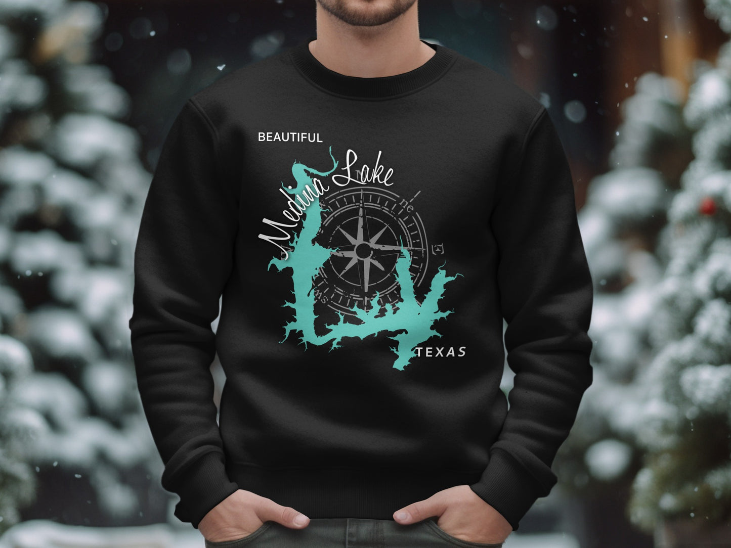 Black sweatshirt with teal Medina Lake map and compass design, Texas.