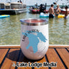 A white insulated travel tumbler with a blue Lake Huron map graphic on a boat deck at the lake.