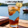 Glass of iced tea with New Hampshire map and compass design, lake background.
