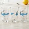 Three clear glasses featuring Enid Lake, Mississippi map and compass designs.
