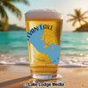 Beer glass with blue Sylvan Lake outline and "SOUTH DAKOTA" text on beach.
