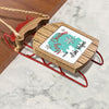 Wooden sled ornament with "Merry Christmas From Lake Helper" text.