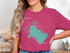 Pink t-shirt with teal Lake Calhoun map and compass graphic.