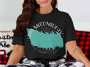 Black t-shirt with turquoise Lake McConaughy map and compass design.