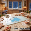Textured glass cutting board featuring a blue map of Lake Mendota on a kitchen counter.