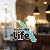 Saylorville Life sticker with a turquoise lake outline over black text.