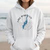 White hoodie with black text "LAKE BOMOSEEN", blue lake map, and compass design.