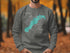 Grey sweatshirt with Lake Marble Falls, Texas map and compass graphic.