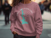 Pink sweatshirt with "Eagle Mountain Lake Texas" and lake graphic.