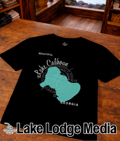 Black t-shirt with a teal compass rose graphic over a map of Lake Calhoun, Georgia.