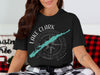 Black t-shirt with Lake Clark Alaska graphic featuring a teal lake outline and compass.