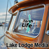Boat window sticker with "Torch Life" and "Lake Lodge Media" text.