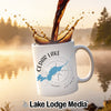 White mug with "Cedar Lake Ontario" and compass design with coffee splash.