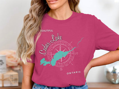 Pink t-shirt with "Beautiful Cedar Lake" compass and map graphic.