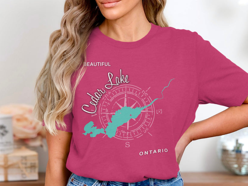 Pink t-shirt with "Beautiful Cedar Lake" compass and map graphic.