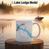 White mug with "Bass Lake California" and map design on wooden pier.