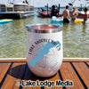 A white travel tumbler with a Lake Marble Falls map logo sits on a boat deck.