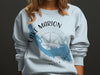 Light blue sweatshirt with Lake Marion map graphic and compass rose.
