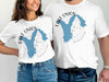 White t-shirts with blue Lake Union Washington map and compass design