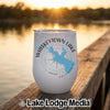 White insulated wine tumbler featuring a blue map graphic of Whiskeytown Lake and compass design sitting on a wooden dock.