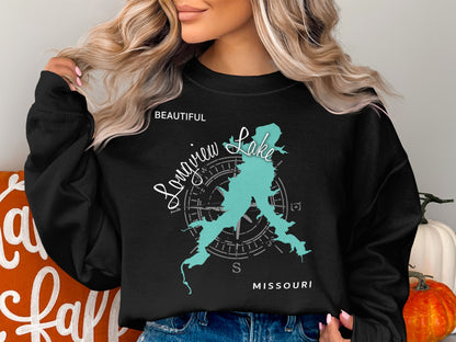 Black sweatshirt with teal Longview Lake map and compass graphic.