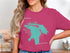 Pink t-shirt featuring a teal map outline of Lake Huron and the word "Beautiful".